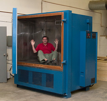 Senior Electrical Research Engineer Tom Cumberland in the newest additions to Axiom's testing regimen is a special temperature and humidity chamber.